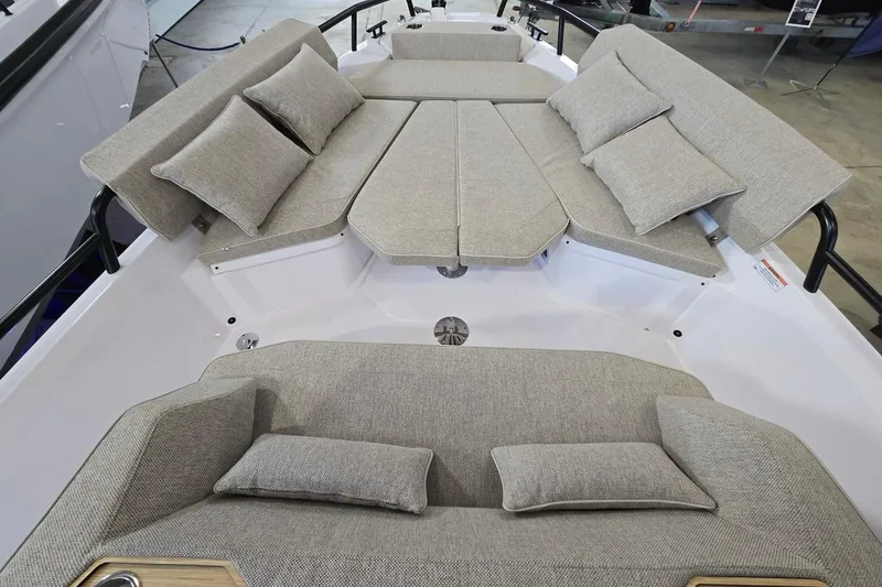 Slide: The Image of Luxurious seating area on 2026 Axopar 29 XC Cross Cabin boat, featuring plush cushions. - 19