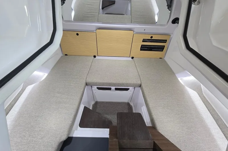 Slide: The Image of Interior of 2026 Axopar 29 XC Cross Cabin with modern seating and storage. - 23