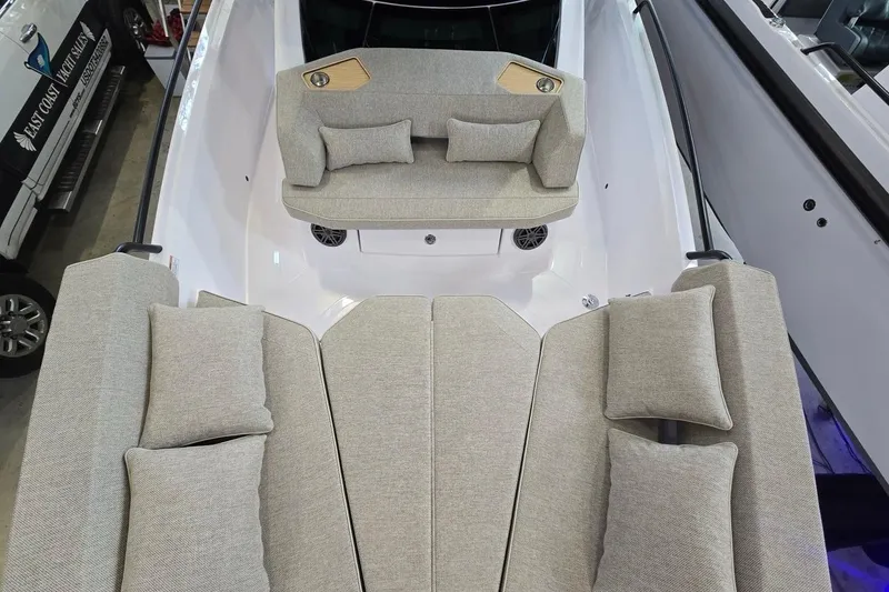 Slide: The Image of 2026 Axopar 29 XC Cross Cabin interior with plush seating and cushions. - 28