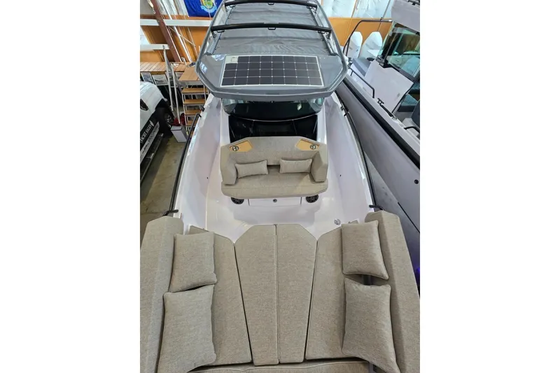 Slide: The Image of 2026 Axopar 29 XC Cross Cabin with spacious seating and solar panel roof. - 29
