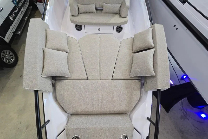 Slide: The Image of 2026 Axopar 29 XC Cross Cabin with plush seating and cushions in a sleek design. - 31