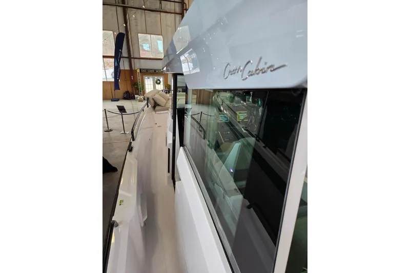 Slide: The Image of 2026 Axopar 29 XC Cross Cabin boat interior view in a showroom. - 32