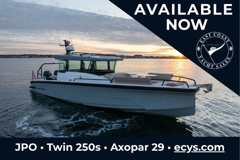 The Image of 2027 Axopar 29 XC Cross Cabin yacht on water at sunset, available now. - 0