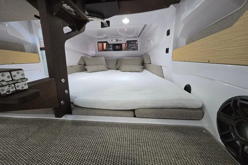 Slide: The Image of 2026 Axopar 29 XC Cross Cabin interior with cozy sleeping area and modern design. - 36