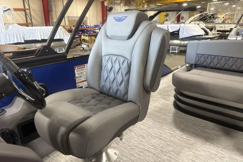 Slide: The Image of Luxurious seating on 2026 Bennington 23 LXS Swingback pontoon boat, featuring diamond-stitched upholstery. - 10