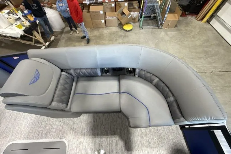 Slide: The Image of Luxurious seating on 2026 Bennington 23 LXS Swingback pontoon boat in a workshop setting. - 6