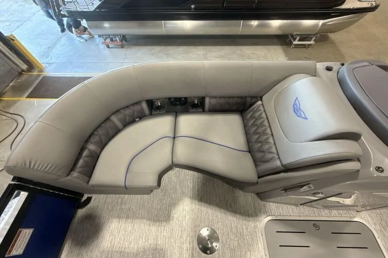 Slide: The Image of Luxurious seating on 2026 Bennington 23 LXS Swingback pontoon boat, featuring elegant gray upholstery. - 7