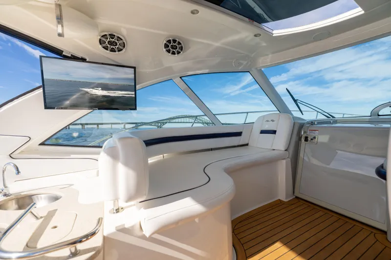 Slide: The Image of Luxurious interior of 2010 Sea Ray 500 Sundancer yacht with sleek seating and modern amenities. - 11