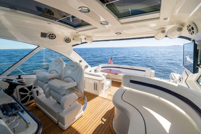 Slide: The Image of Luxurious 2010 Sea Ray 500 Sundancer yacht interior with plush seating and ocean view. - 19