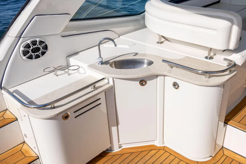 Slide: The Image of Luxurious 2010 Sea Ray 500 Sundancer yacht kitchenette with sink and speaker. - 23