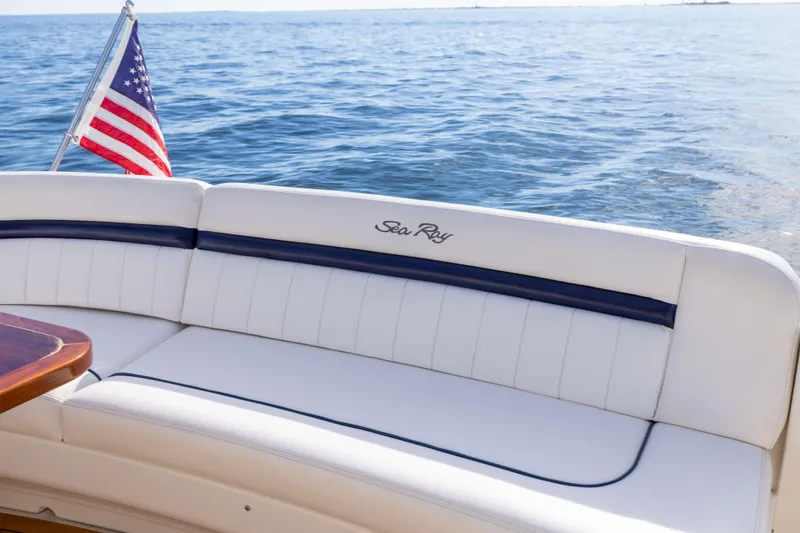 Slide: The Image of 2010 Sea Ray 500 Sundancer yacht with American flag, ocean view. - 26