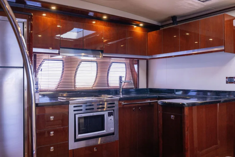 Slide: The Image of Luxurious kitchen interior of 2010 Sea Ray 500 Sundancer yacht with modern appliances. - 32