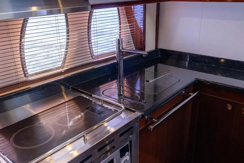 Slide: The Image of Luxurious kitchen interior of 2010 Sea Ray 500 Sundancer yacht with modern appliances. - 34