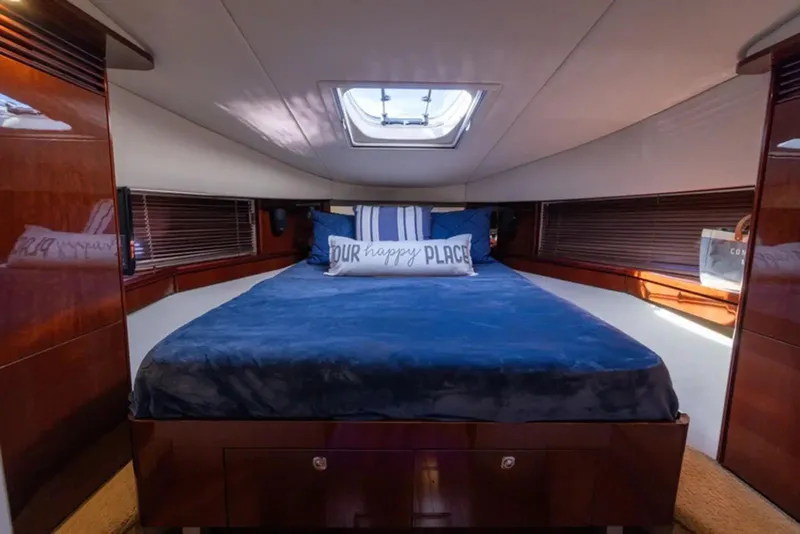 Slide: The Image of Luxurious cabin interior of 2010 Sea Ray 500 Sundancer yacht with cozy bedding. - 36