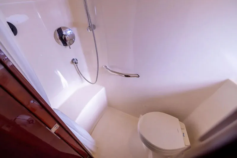Slide: The Image of Bathroom interior of 2010 Sea Ray 500 Sundancer yacht, featuring shower and toilet. - 44