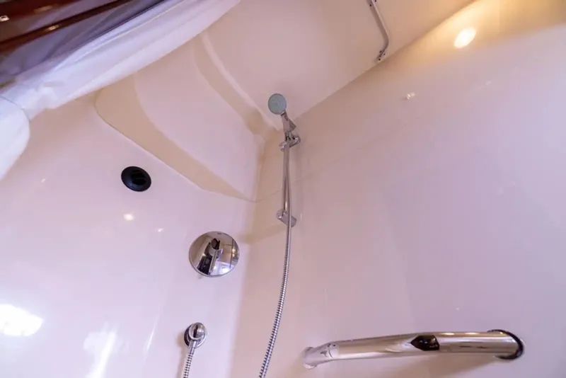 Slide: The Image of Shower area in 2010 Sea Ray 500 Sundancer yacht, featuring modern fixtures and lighting. - 46