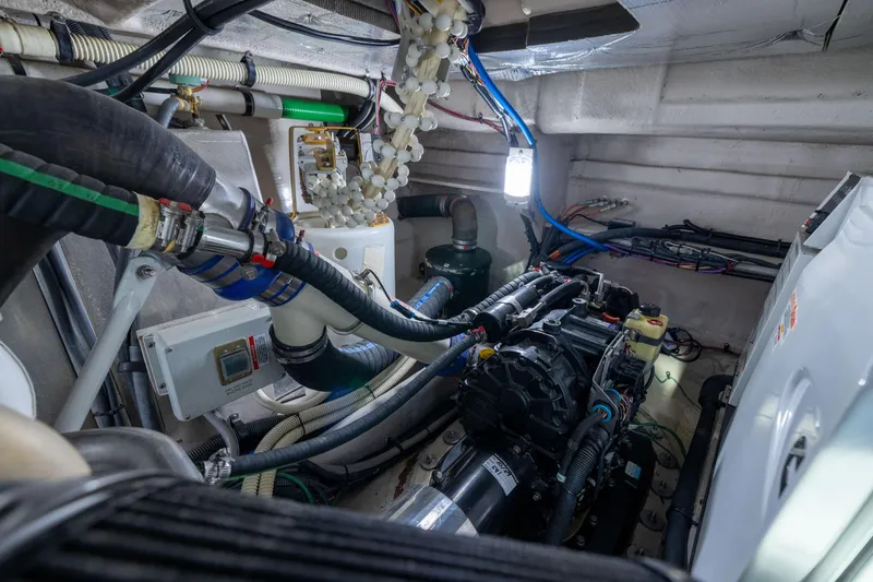 Slide: The Image of Engine room of a 2010 Sea Ray 500 Sundancer yacht, showcasing mechanical components. - 48