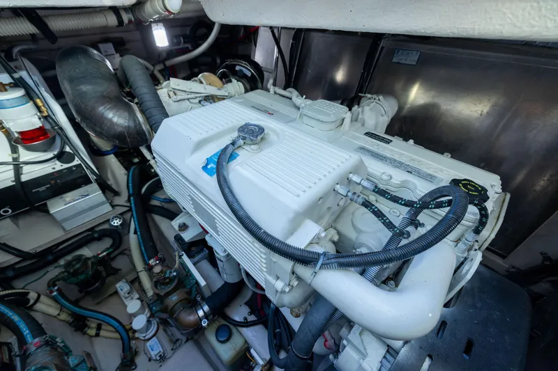 Slide: The Image of Engine room of 2010 Sea Ray 500 Sundancer, showcasing detailed mechanical components and wiring. - 50