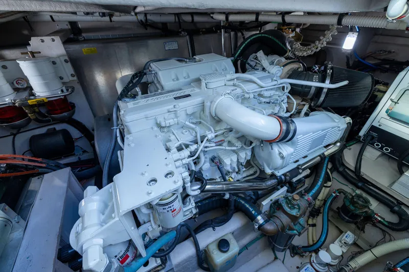 Slide: The Image of Engine room of a 2010 Sea Ray 500 Sundancer yacht, showcasing detailed machinery. - 53