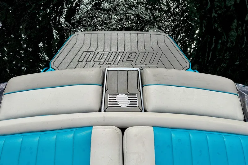 Slide: The Image of 2016 Malibu Wakesetter 25 LSV boat interior with blue and gray seating. - 21