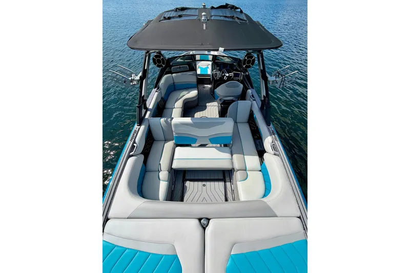 Slide: The Image of 2016 Malibu Wakesetter 25 LSV boat interior with spacious seating on water. - 22