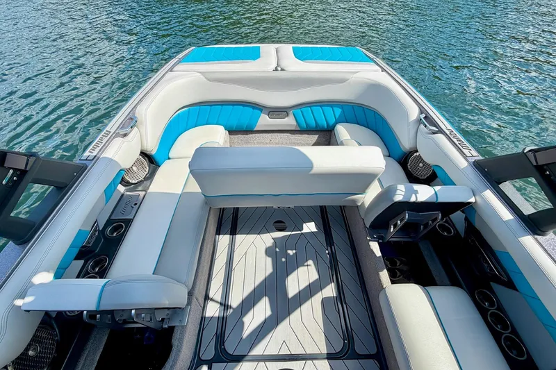 Slide: The Image of 2016 Malibu Wakesetter 25 LSV interior with blue and white seating on water. - 23