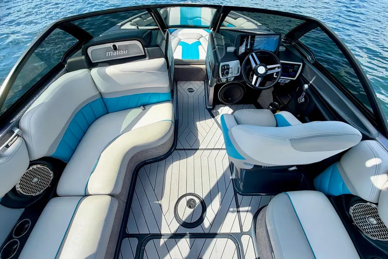 Slide: The Image of Interior of 2016 Malibu Wakesetter 25 LSV boat with modern seating and controls. - 25