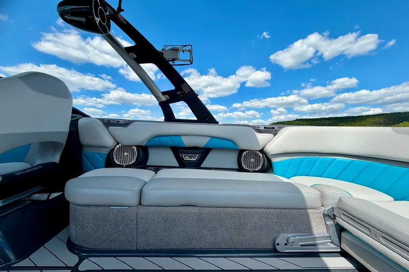 Slide: The Image of 2016 Malibu Wakesetter 25 LSV interior with blue skies and plush seating. - 28