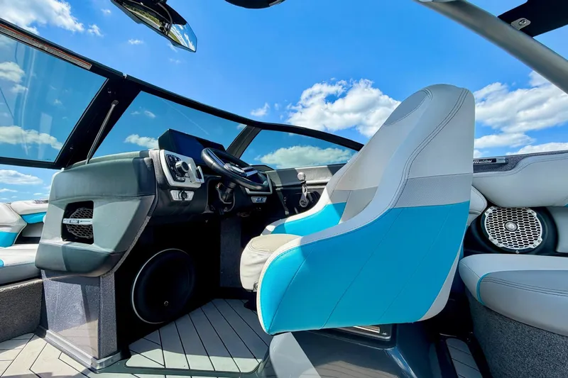 Slide: The Image of Interior of 2016 Malibu Wakesetter 25 LSV boat with blue skies above. - 29