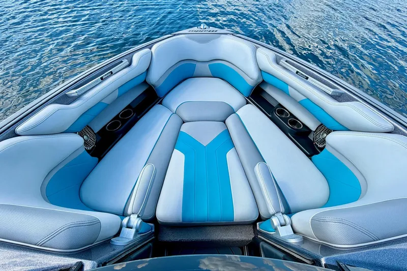 Slide: The Image of Interior of 2016 Malibu Wakesetter 25 LSV boat with blue and gray seating. - 33