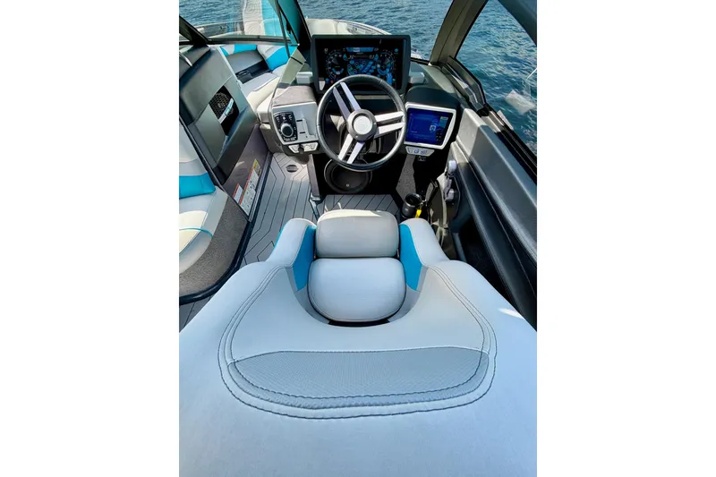 Slide: The Image of Interior view of 2016 Malibu Wakesetter 25 LSV boat cockpit with modern controls. - 36
