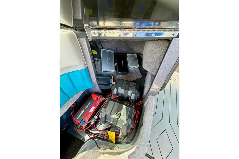 Slide: The Image of 2016 Malibu Wakesetter 25 LSV interior showing electronic components and wiring setup. - 37
