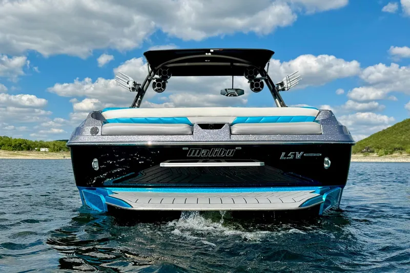 Slide: The Image of 2016 Malibu Wakesetter 25 LSV on water, under blue sky with clouds. - 5