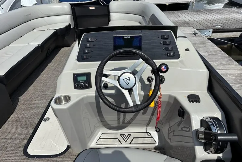 Slide: The Image of 2023 Viaggio LAGO 25S boat interior with steering wheel and control panel. - 10