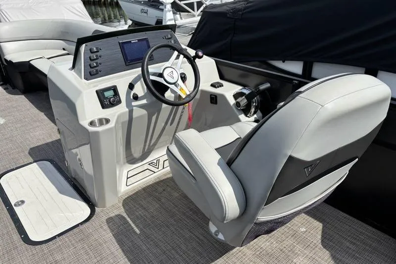 Slide: The Image of 2023 Viaggio LAGO 25S boat helm with modern steering and controls. - 9