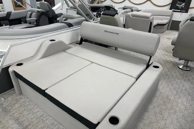 Slide: The Image of 2026 Berkshire 24UL LE B boat interior with plush seating and cup holders. - 6