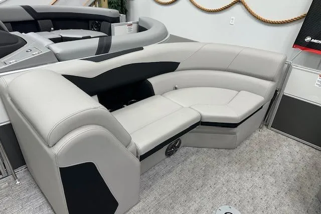 Slide: The Image of Luxurious seating on 2026 Berkshire 24UL LE B pontoon boat, featuring sleek gray and black upholstery. - 8