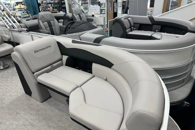 Slide: The Image of Luxurious seating on a 2026 Berkshire 24UL LE B pontoon boat in showroom. - 9