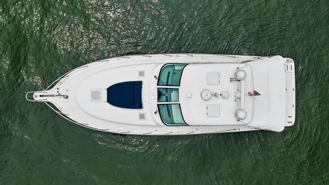 Slide: The Image of Bow view of a 2004 Tiara 3800 yacht docked at a marina. - 10