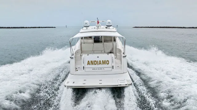 Slide: The Image of 2004 Tiara 3800 boat on stands, side view, outdoors. - 13