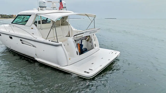 Slide: The Image of Tiara 3800 boat from 2004, named "Our Gang," docked in Massapequa, NY. - 14