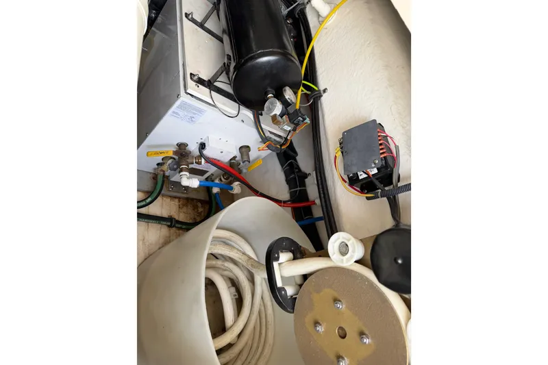 Slide: The Image of Engine compartment of a 2004 Tiara 3800, featuring wiring and mechanical components. - 25