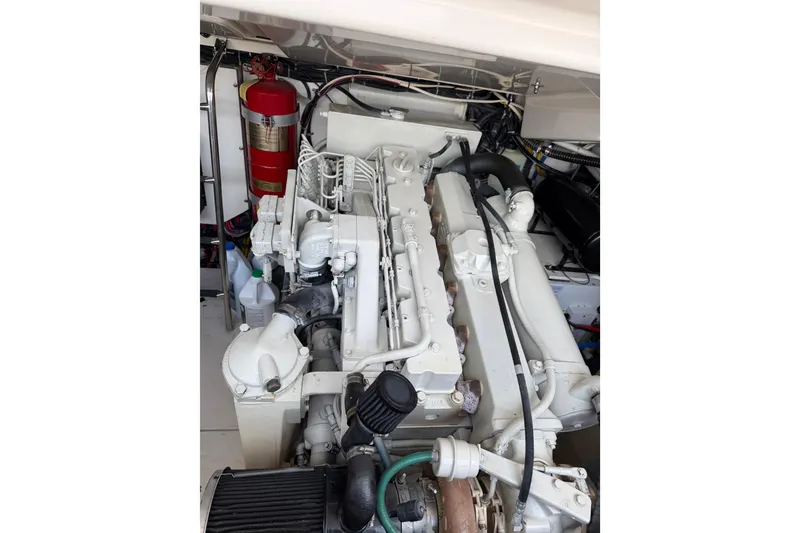 Slide: The Image of Engine compartment of a 2004 Tiara 3800 boat with visible fire extinguisher. - 26