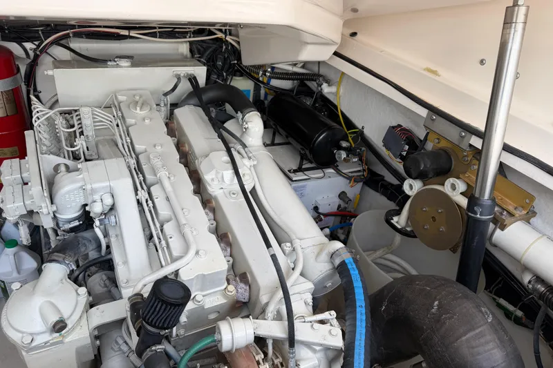 Slide: The Image of Engine compartment of a 2004 Tiara 3800 boat, showcasing detailed mechanical components. - 28
