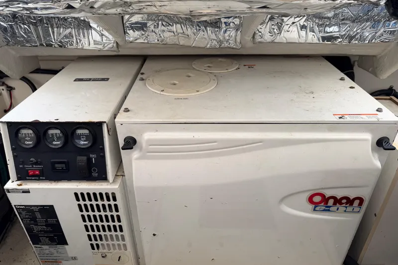 Slide: The Image of Onan generator in a 2004 Tiara 3800 boat engine room. - 29