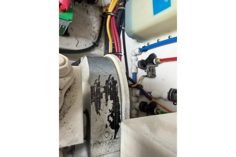 Slide: The Image of Engine compartment of a 2004 Tiara 3800 with visible wiring and components. - 34