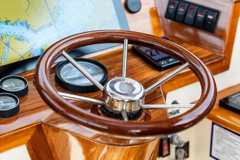 Slide: The Image of Steering wheel and dashboard of 2002 Hinckley Picnic Boat 36 EP. - 12