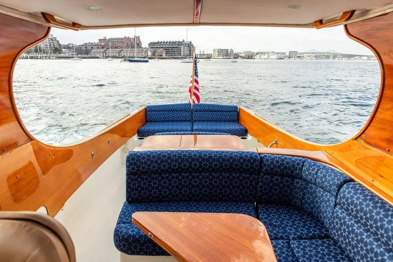 Slide: The Image of Luxurious 2002 Hinckley Picnic Boat 36 EP interior with waterfront view. - 16