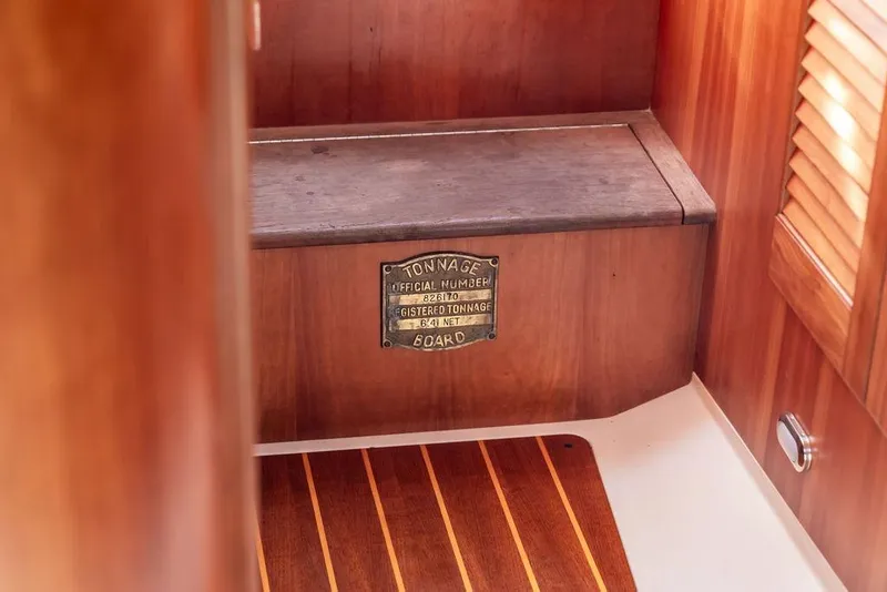 Slide: The Image of Interior of 2002 Hinckley Picnic Boat 36 EP with wooden finish and tonnage plaque. - 27