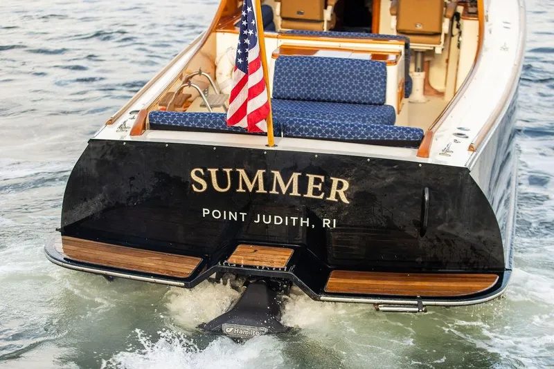 Slide: The Image of Hinckley Picnic Boat 36 EP 2002 cruising with American flag, named "Summer," Point Judith, RI. - 5